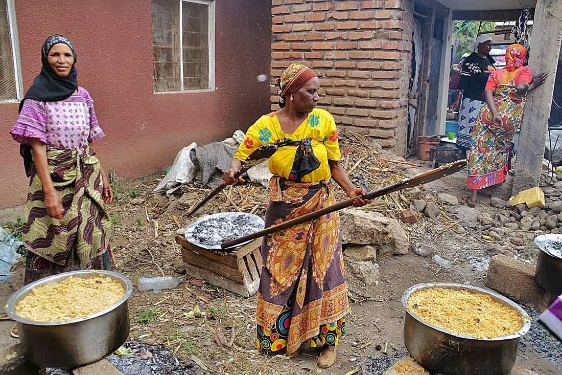 Women in the rural areas prepare a big feast for their families and 300 orphans