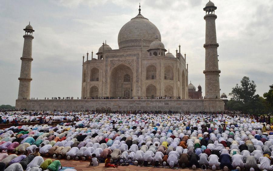 Indian Muslims offer prayers at a mosque in the premises of the Taj Mahal in Agra, India, Tuesday, July 29, 2014. Millions of Muslims across the world are celebrating the Eid al-Fitr holiday, which marks the end of the month-long fast of Ramadan. (AP Photo/Pawan Sharma)