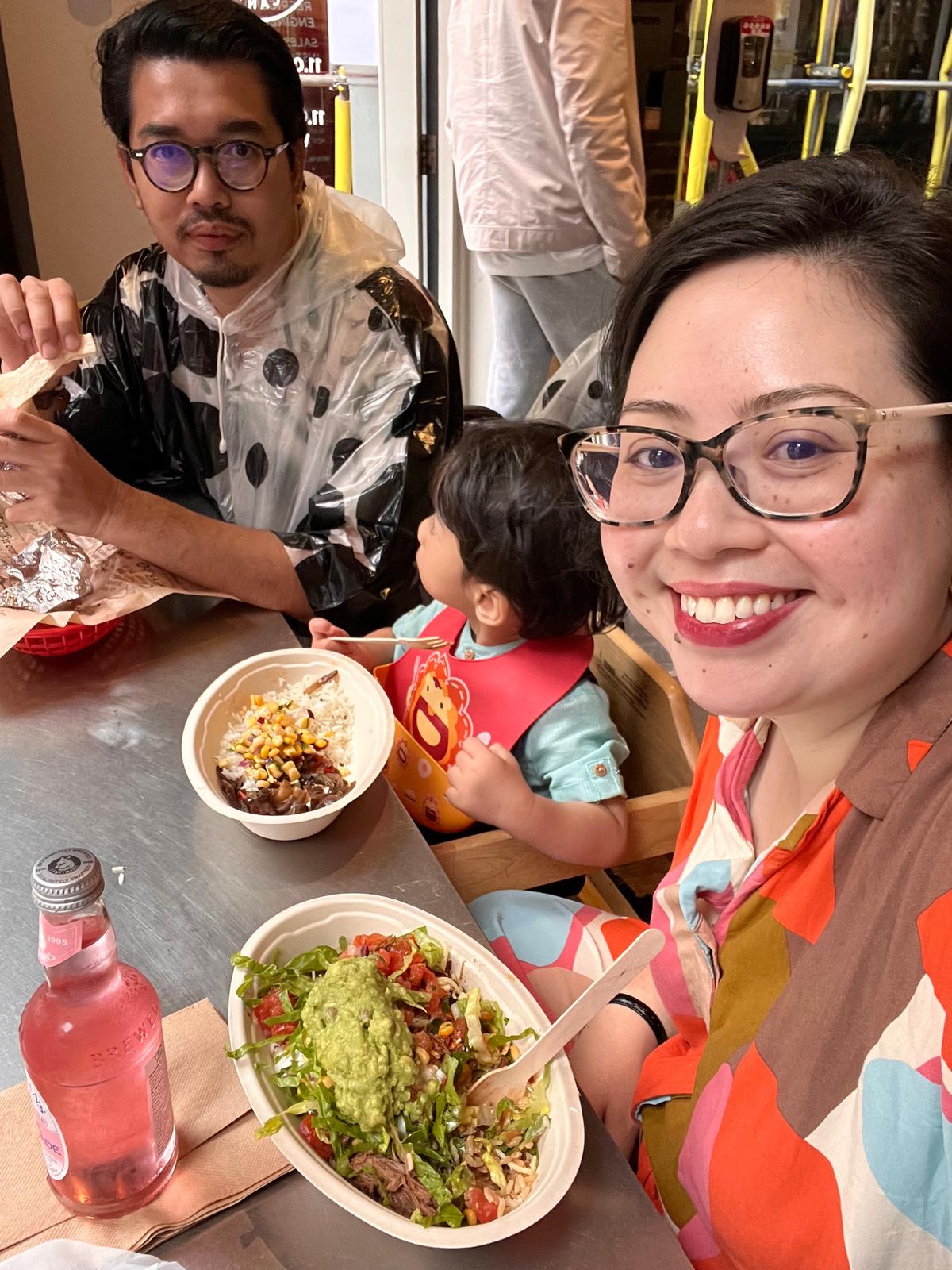 A family of three enjoying Mexican food in London